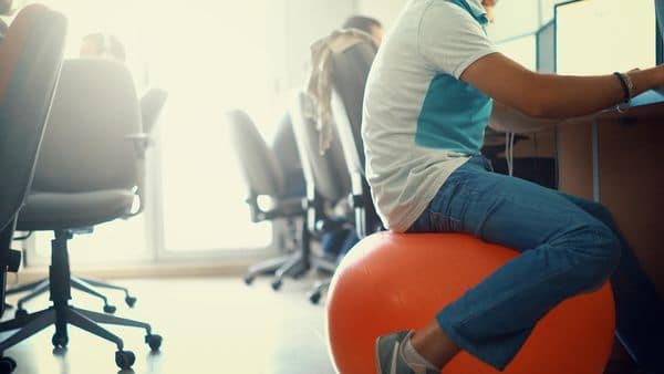 sitting on pilates ball