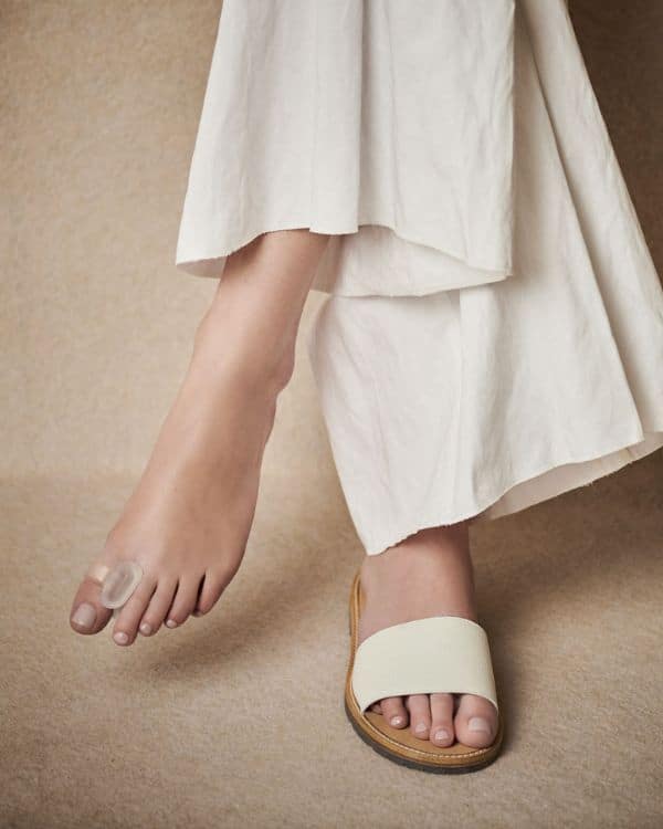 lifestyle photo of a woman wearing a toe ring separator